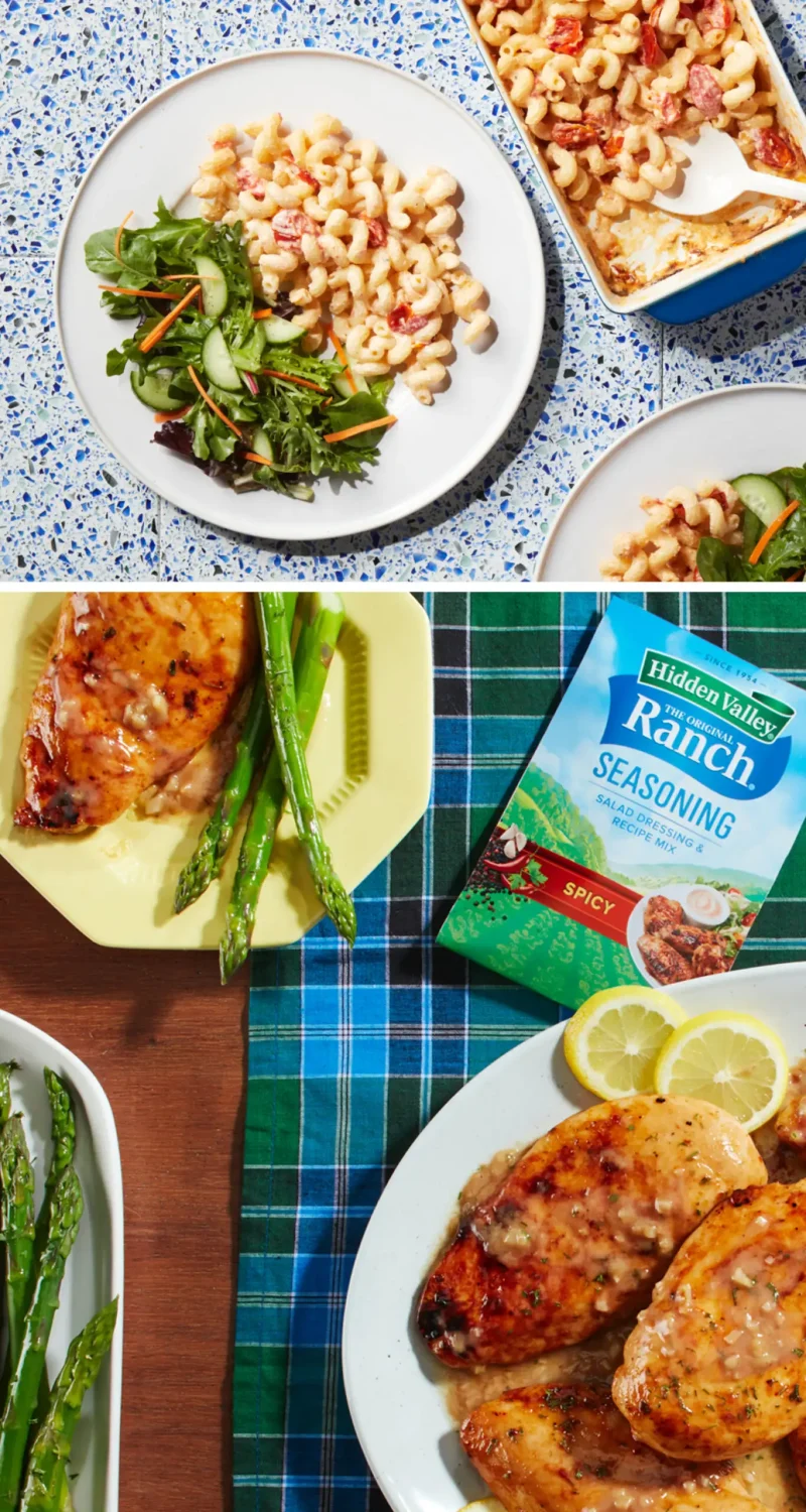 Mac and cheese with salad on a table, grilled chicken with asparagus, and a spicy ranch seasoning pack.